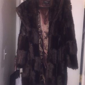 Pre owned very warm Women’s coat with hood size large.